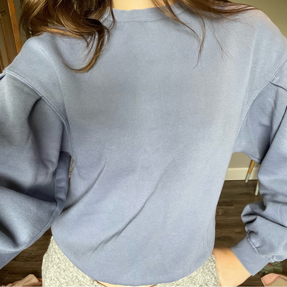 Indigo/Purple H&M sweatshirt with puff sleeves.